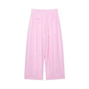 Detail view of pink high-waist wide-leg pants featuring elastic waist and back welt pockets