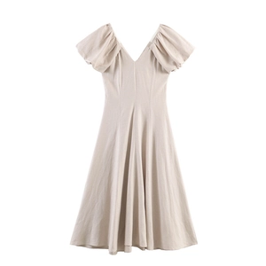 Elegant apricot puff sleeve V-neck maxi dress with cinched waist and A-line silhouette
