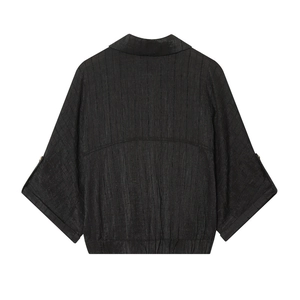 Women's black safari style pleated shirt with rolled sleeves and elasticated hemline