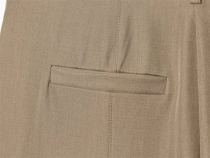 Detail of premium khaki trousers showing the welt pocket and durable twill fabric