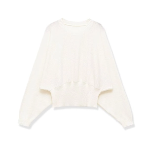Minimalist white crew neck knit sweater featuring loose batwing sleeves and ribbed waist hem