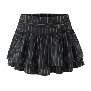 Detail of black and white striped tiered ruffle mini skirt with metal buckle belt detail