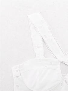 Detailed view of white eyelet embroidery corset top with delicate scallop lace trims