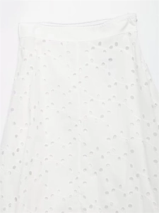 Detailed view of white cotton eyelet embroidery skirt fabric with invisible side zipper