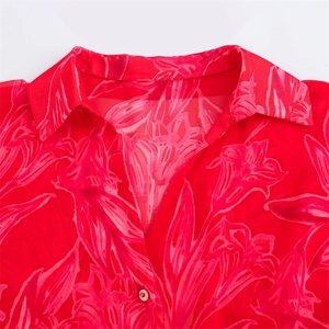 Women's floral print chiffon shirt featuring red background and pink blossoms