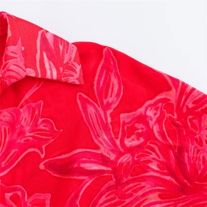 Close-up of floral print chiffon shirt featuring lapel collar and delicate fabric texture
