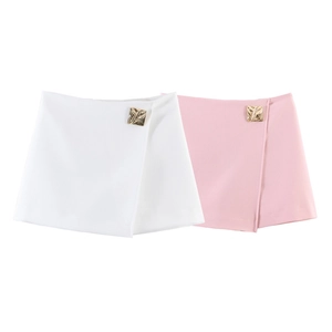 Detail of wrap skort showing square gold metal buckles on white and pink fabric