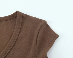Detail shot of the V-neckline and soft fabric texture of a brown slim-fit summer T-shirt