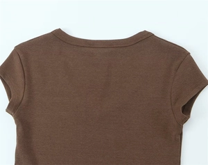 Detailed close-up of dark brown cotton T-shirt neckline with clean stitching and soft texture