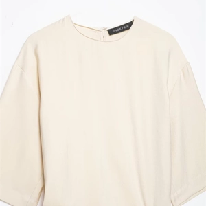 Minimalist beige pleated midi dress with round neck and loose fit design