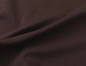 Detailed macro view of dark brown knit fabric texture for V-neck sleeveless T-shirt