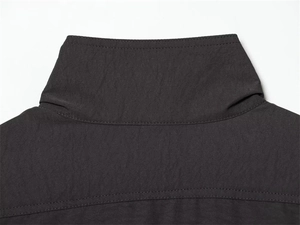 Detail of a black stand collar blouse featuring high-quality double-needle stitching and texture