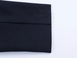 Detailed view of the smooth woven fabric and neat stitching on this oversized blazer