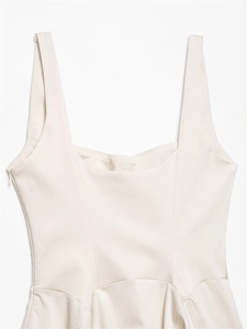 Detail view of cream sleeveless mini dress featuring side invisible zipper and square neckline