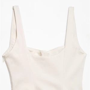Elegant ivory white sleeveless mini dress with wide straps and side hidden zipper