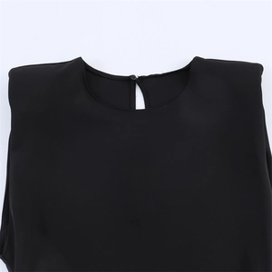 Women's chic black sleeveless top with shoulder pads and asymmetric hem design