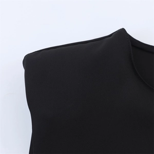 Macro shot of black dress shoulder pads featuring detailed twill fabric texture