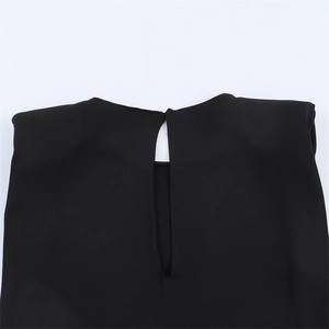 Close-up of black dress back neck with teardrop cutout and clean stitched edging