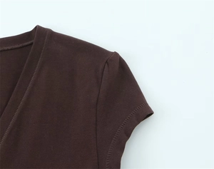 Detail of V-neck stitching and shoulder seams on a coffee brown cotton knit T-shirt