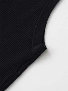 Close-up of the ribbed knitting pattern and high-quality seam on a black sleeveless top