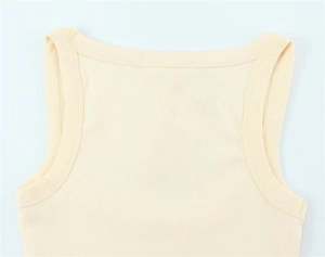 Close-up of neckline and knit texture on the light beige sleeveless cotton t-shirt
