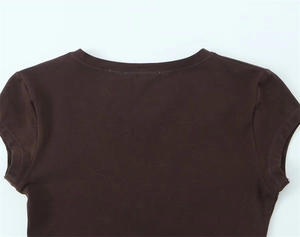 Detail view of round neckline and shoulder stitching on a dark brown cotton T-shirt