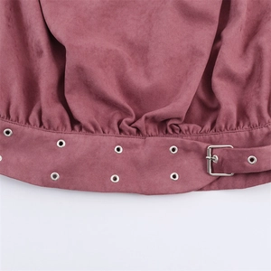Detail of faux suede hem in dusty rose with silver metal buckle and eyelet belt