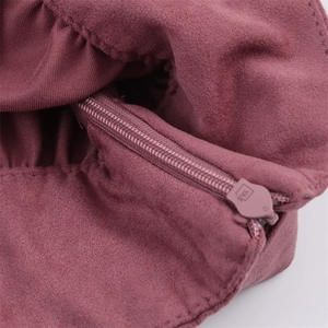 Macro detail of high-quality zipper and premium faux suede texture on mauve jacket