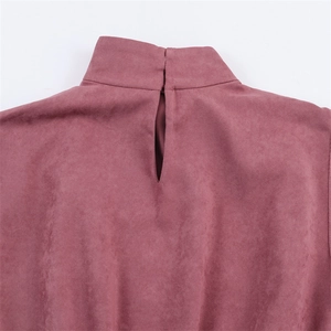 Detail of the mock neck and keyhole cutout on the back of the faux suede top