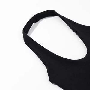 Close-up of black halter neck top featuring ribbed knit fabric and precise stitching details