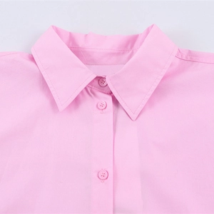Pink long sleeve poplin shirt with turn-down collar and matching resin buttons