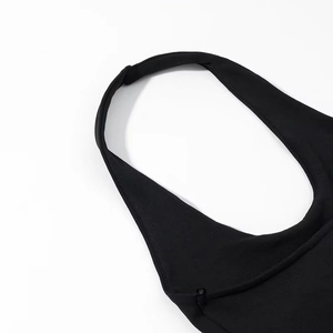 Close-up detail of black halter neck top featuring high-quality ribbed knit fabric texture