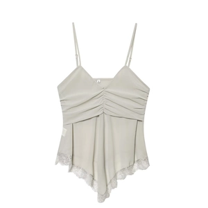 Close-up of ruched V-neckline and delicate lace trim on silver camisole top