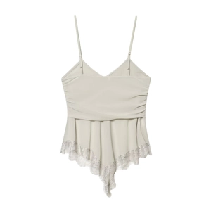 Detail view of light grey georgette top with thin straps and delicate lace trim hemline
