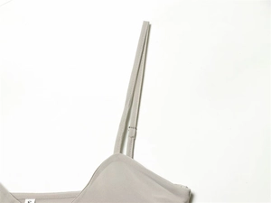 Close-up of adjustable shoulder straps and size S label on a lace camisole top