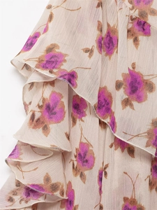 Detail shot of multi-layer ruffled chiffon fabric with vintage floral print in apricot