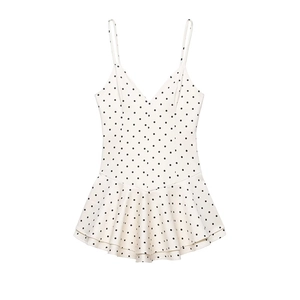 Polka dot short jumpsuit dress with thin straps and ruffled hem in cream and black