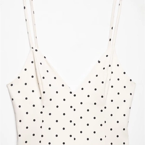French style polka dot camisole dress with spaghetti straps and a deep V-neckline