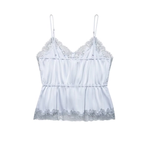 Pale blue satin camisole top with lace trim and elasticated waist on white background