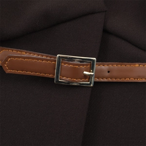 Close-up of brown waistcoat with adjustable faux leather strap and gold buckle detail