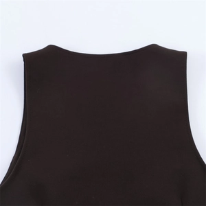 Macro detail of dark brown knit vest showing seamless round neckline and shoulder stitching