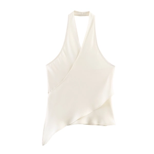 Detail of ivory satin halter neck top with crisscross wrap front and asymmetric hemline