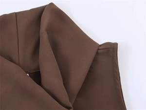Detailed view of the fine stitching and texture on the dark brown V-neck chiffon top