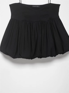 Close-up of black bubble hem camisole top with thin straps and gathered waist details