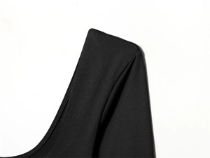 Close-up of high-quality black elastic fabric showing fine stitching and smooth texture