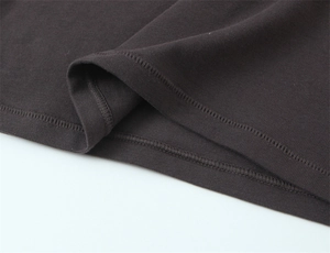 Detail of slim fit charcoal knit T-shirt showing high-quality double-needle hem stitching