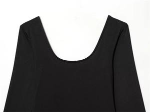 Close-up of deep U-neckline on a slim-fit black long-sleeve bodysuit for women