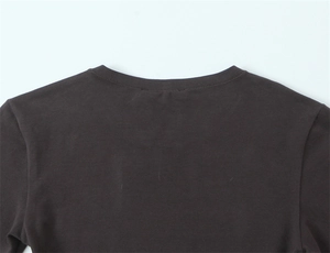 Close-up of the round neckline and stitching on this slim-fit dark brown jersey t-shirt