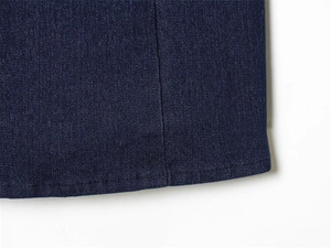 Detail shot of navy blue denim corset hemline with precise double-needle flat stitching