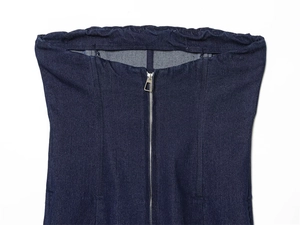 Detail of dark blue denim corset top featuring silver front zipper and elasticated top edge